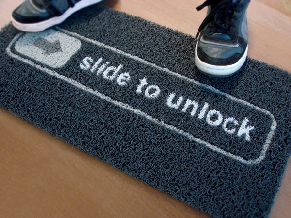 slide-to-unlock-iphone-doormat-black.jpg